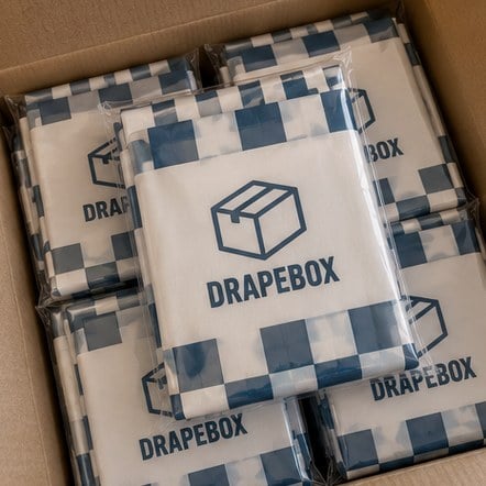Wholesale shower curtains in clear packaging inside a shipping box